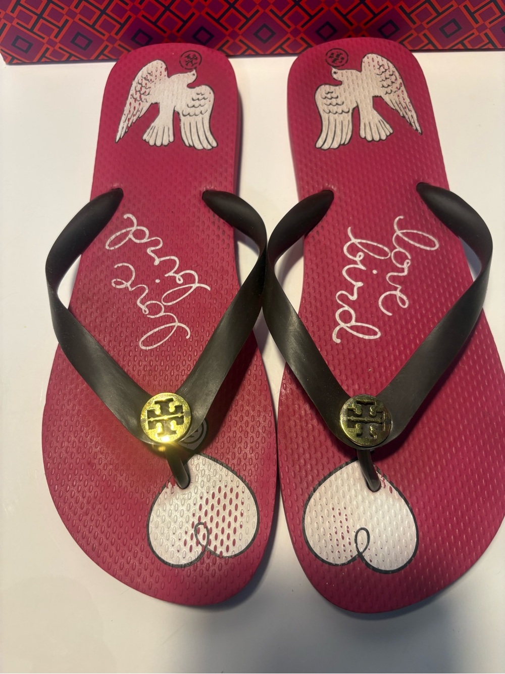 Tory Burch Magenta Flip Flops with Black Straps and Gold Medallion